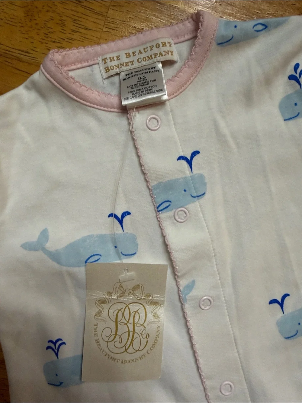 The Beaufort Bonnet Company White Footie with Blue Whale Print and Pink Trim